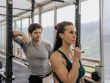 A fit couple engaged in gym exercises. Indoor workout with focus on fitness goals.